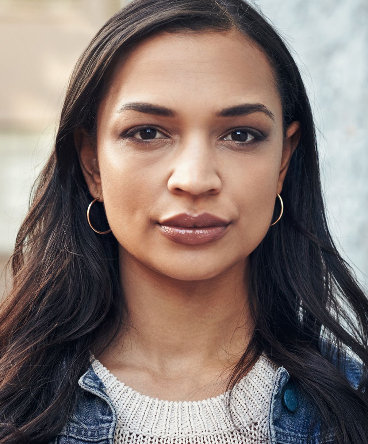 Portrait of a woman with long dark hair.