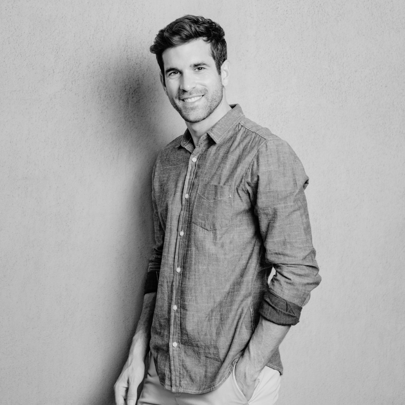 Young man with curly hair and toned physique.