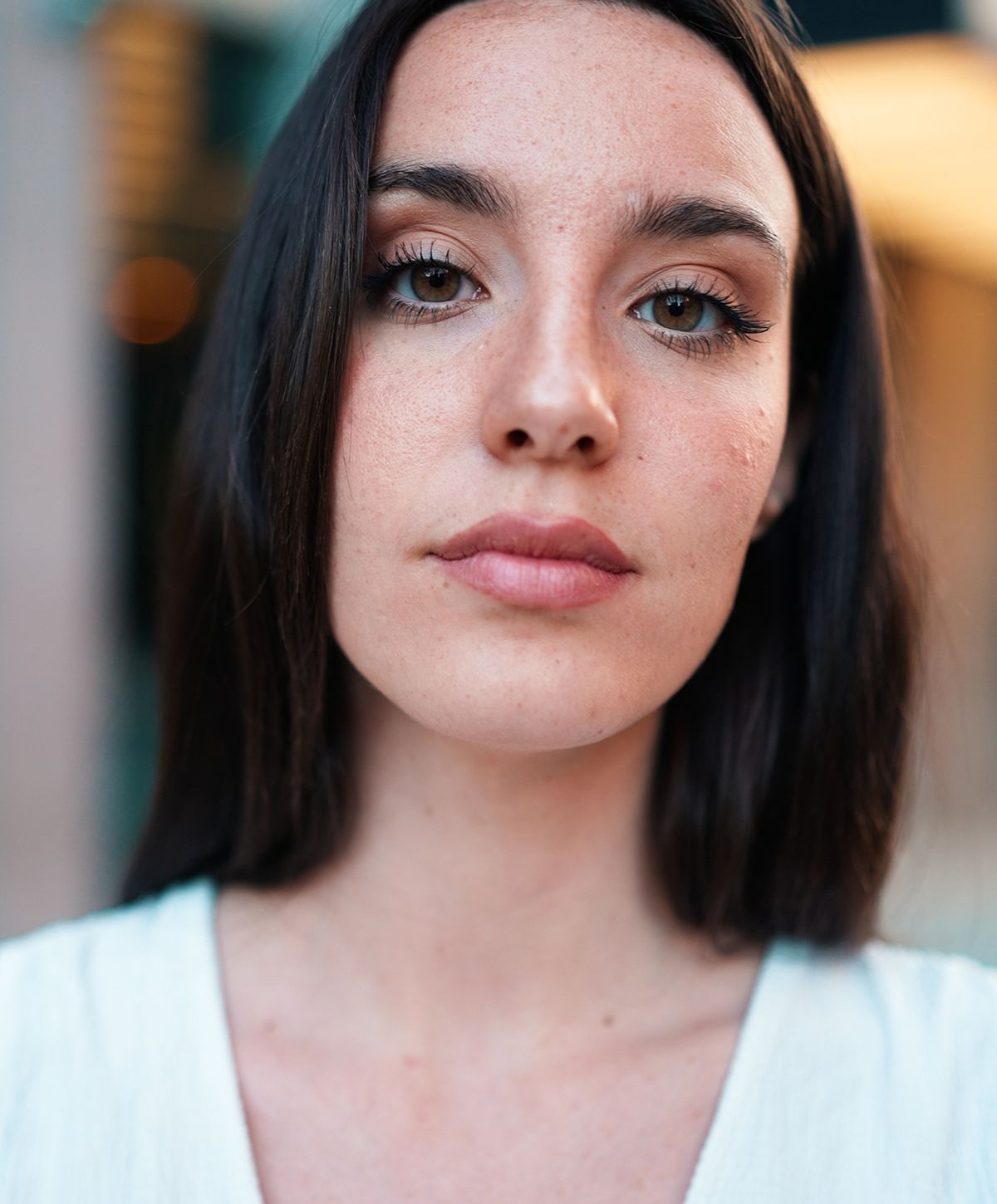 Woman with long hair and natural makeup.